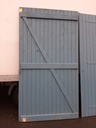 Porte de garage battante en bois (2 vantaux)
